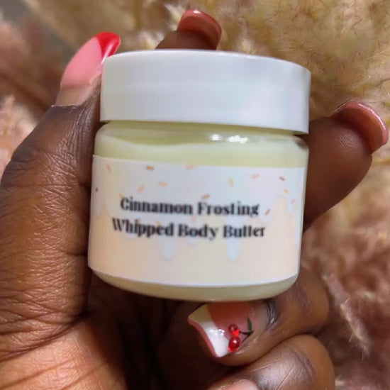 Small jar of NoùNoù Beauty Cinnamon Frosting Body Butter in sampler size, creamy whipped texture inside the jar.”
